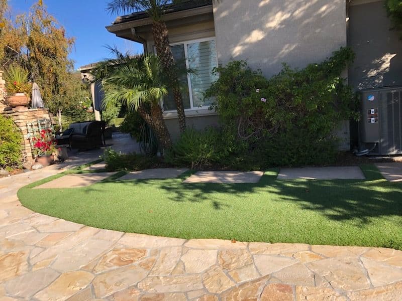 Gallery photos for Backyard Oasis with Artificial Grass and Stone Paths: Image #1